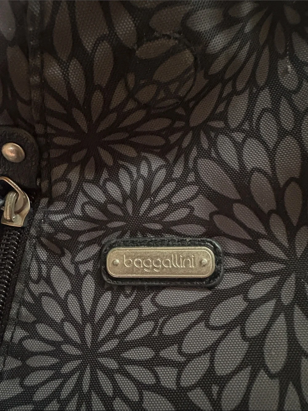 Baggallini Black and Gray Floral Sling Backpack